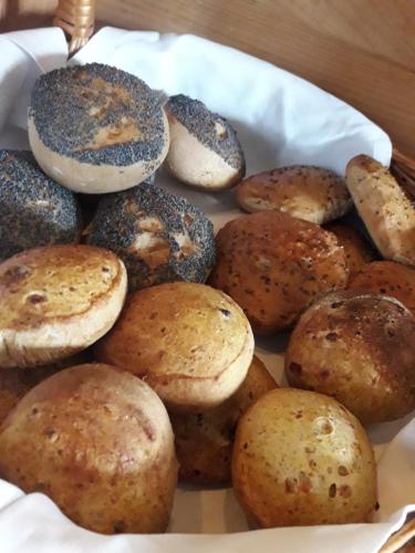 a plate of muffins and mushrooms on a table at Breanäs Hotell in Immeln