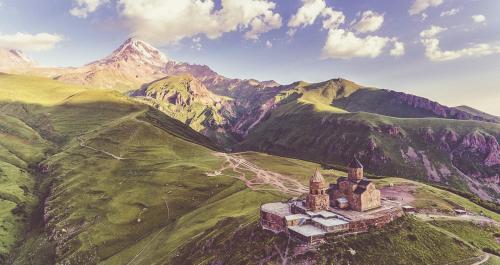 an aerial view of a castle on a mountain at Kaxa Shorena Guest-House in Stepantsminda