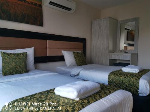 Postel nebo postele na pokoji v ubytování Yeob Bay hotel Ampang