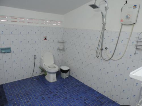 a bathroom with a shower and a toilet and a sink at Blue Paradise Residence in Rawai Beach