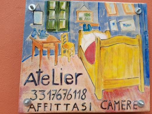 una pintura de una habitación con una cama y una mesa en ATELIER, en Voghera