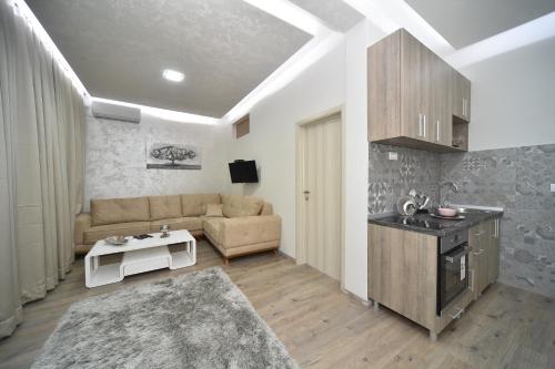 a living room with a couch and a table at Atlas Apartments in Belgrade