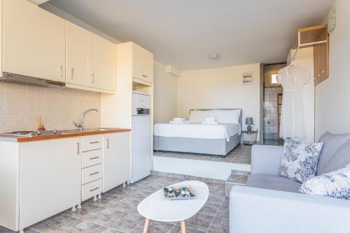 Ένα ή περισσότερα κρεβάτια σε δωμάτιο στο Naftilos Residences II
