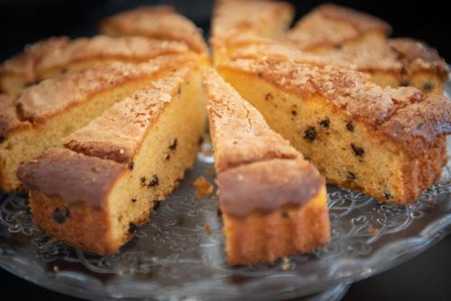 a close up of a cake on a glass plate at JR Hotels Gigli Firenze in Calenzano