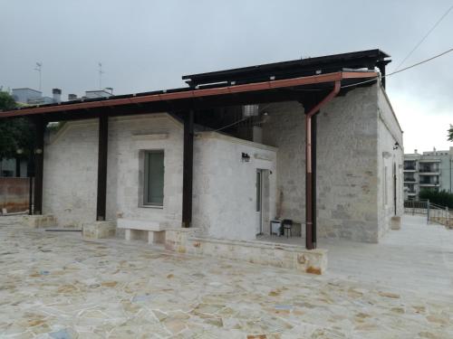 a building with a roof on top of it at Trulli Manuela 2 in Locorotondo