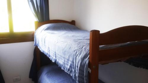 Una cama o camas cucharillas en una habitación de Summer House, Gesell