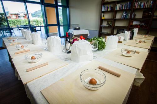a row of tables with bowls on top of them at Tuscany Inn in Montecatini Terme