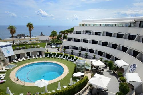 an aerial view of a hotel with a pool and a building at President Park Hotel in Acitrezza