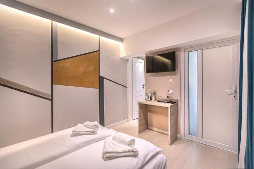 a bathroom with a bed and a sink and a mirror at Casa SEDRA in Braşov