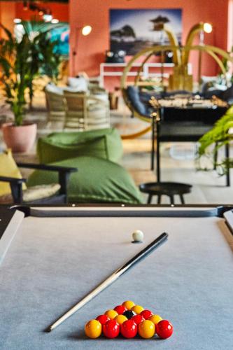a pool table with cue balls on top of it at Mercure Paris Orly Airport in Orly