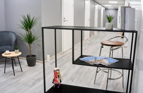 a black shelf with a toy car on it in a room at Inn Tourist Hostel in Helsinki