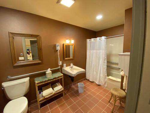 a bathroom with a toilet and a sink at Chambery Inn in Lee