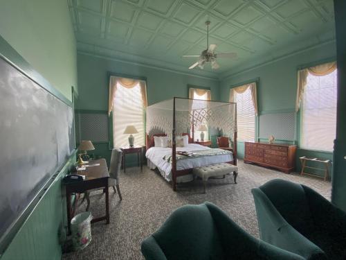 a bedroom with a bed and a ceiling fan at Chambery Inn in Lee