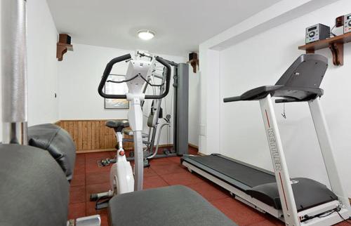 a gym with two exercise bikes and a treadmill at Complex Staro Bardo in Zheravna