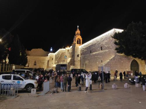 a group of people standing in front of a building at Dar Jacaman - In the heart of Bethlehem old city in Bethlehem