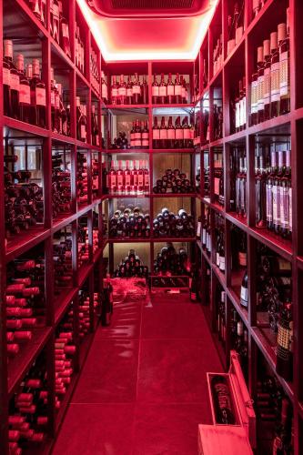 a wine cellar filled with lots of bottles of wine at 3 Sixty Hotel & Suites in Nafplio