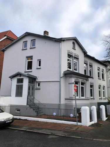 a white house on the side of a street at meierstrasse in Lübeck