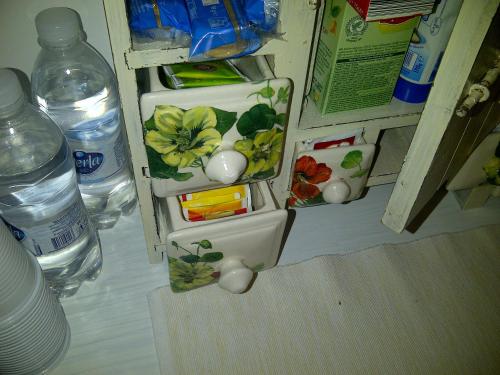 an open refrigerator with some food and water bottles at B&B A Casa di Mael in San Costanzo