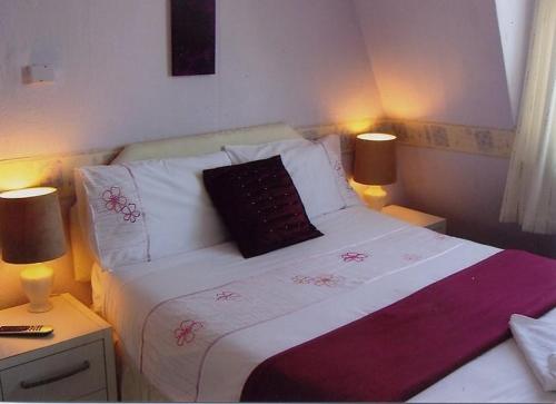 Ένα ή περισσότερα κρεβάτια σε δωμάτιο στο Citadel House Hotel