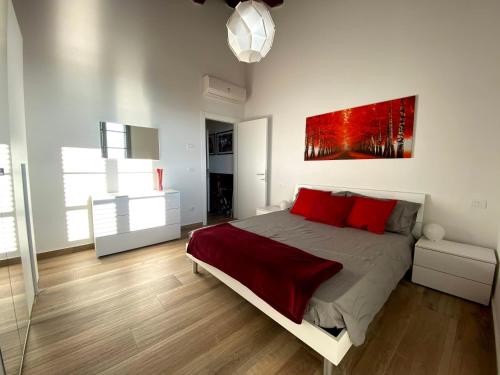 a bedroom with a bed and a painting on the wall at Il Cerro in Arezzo