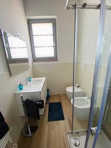 a bathroom with a sink and a toilet and a shower at Il Cerro in Arezzo