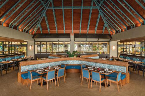 a rendering of a restaurant with tables and chairs at Secrets La Romana All-Inclusive Adult Only Resort & Spa in Bayahibe