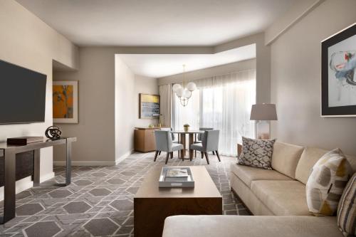 a living room with a couch and a table at Fairmont Scottsdale Princess in Scottsdale