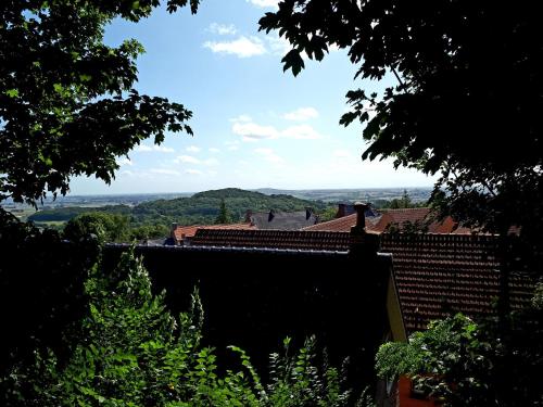 a view of the countryside from the roof of a house at Gîte Au Cœur de Cassel in Cassel