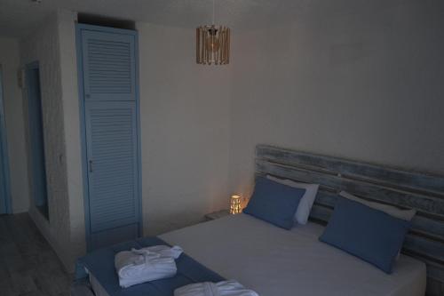 Кровать или кровати в номере Thea Butik Hotel & Restaurant