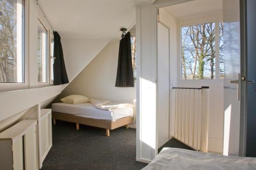 Postel nebo postele na pokoji v ubytování Camping het Wieskamp