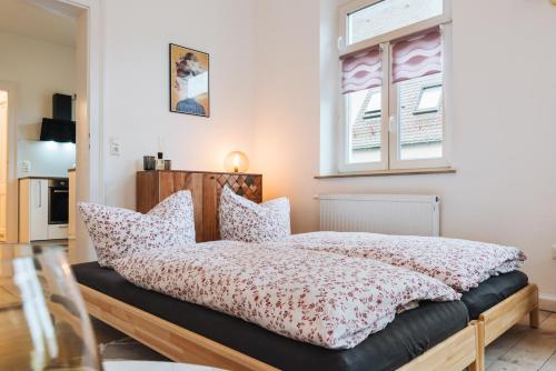 Ein Bett oder Betten in einem Zimmer der Unterkunft #1 AUGSBURG Altstadtjuwel