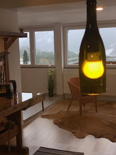 a room with a wine bottle with a light in it at Mariazeller Rooms in Mariazell