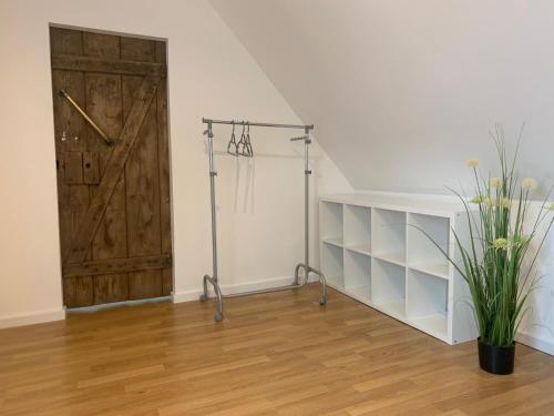 a room with a closet with a wooden door at Mariazeller Rooms in Mariazell