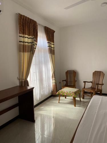 Ένα ή περισσότερα κρεβάτια σε δωμάτιο στο Welcome Family Guest House.