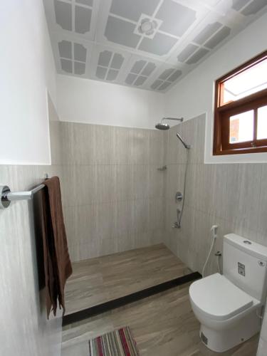 Ένα μπάνιο στο Welcome Family Guest House.
