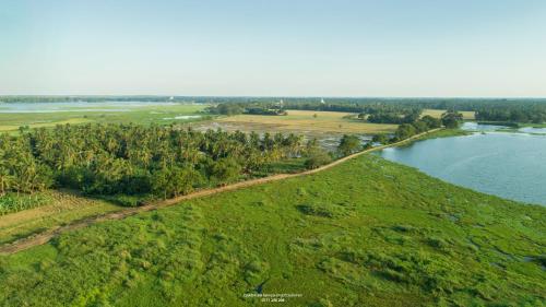 an aerial view of a river and a field at Dearly Holiday Home And Safari in Tissamaharama