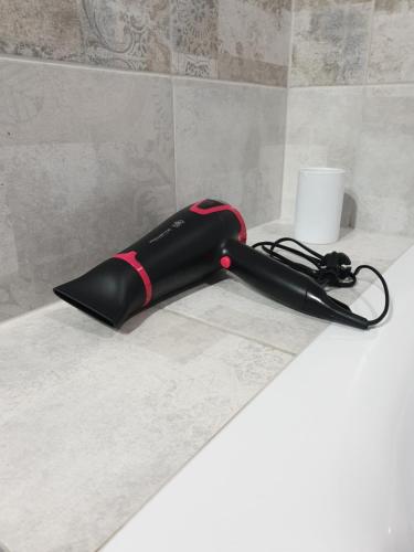 a black umbrella sitting on top of a counter at New apartment 1 in Lviv