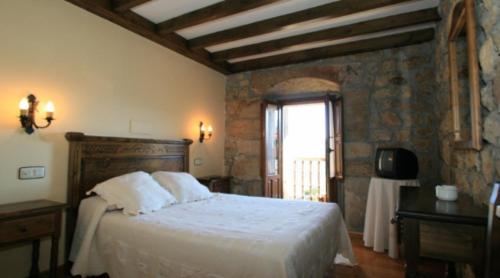 Giường trong phòng chung tại Posada La Colodra
