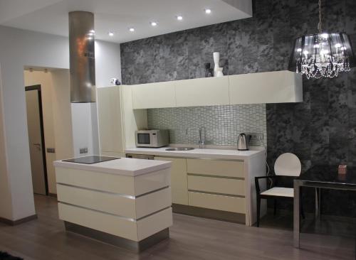 a kitchen with a sink and a counter top at Central Area Apartments in Kyiv