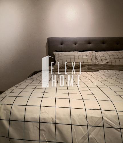 a bedroom with a bed with the word houston written on it at NETFLIX-Pinnacle PJ, Fantastic City View, 1-6 Guests Designed Duplex Home by Flexihome-MY in Petaling Jaya