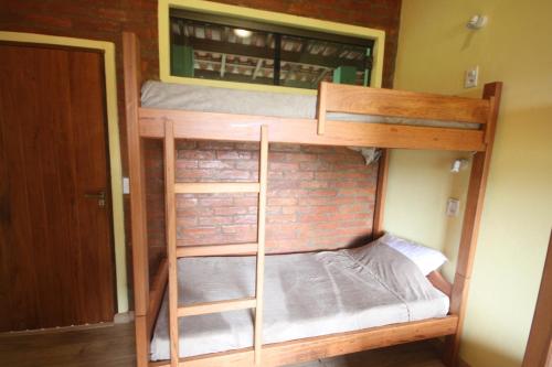 Una cama o camas en una habitación de Pousada Campestre Sítio da Lua