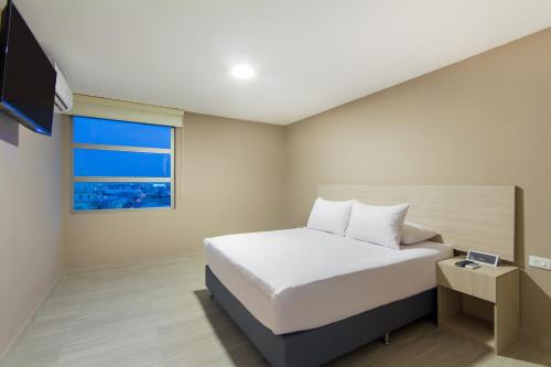 Postel nebo postele na pokoji v ubytování Ribai Hotels - Barranquilla
