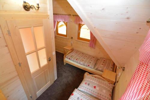 Postel nebo postele na pokoji v ubytování Chalets Adriana