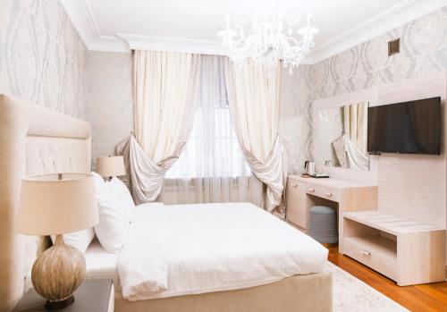 Ένα ή περισσότερα κρεβάτια σε δωμάτιο στο Eclat Luxury Hotel