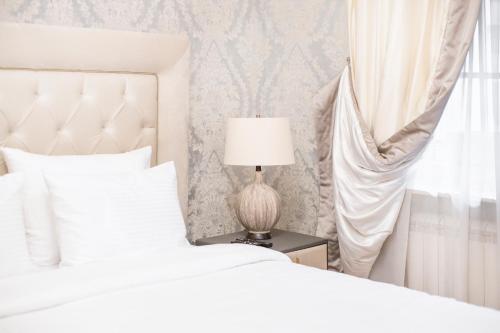 Ένα ή περισσότερα κρεβάτια σε δωμάτιο στο Eclat Luxury Hotel