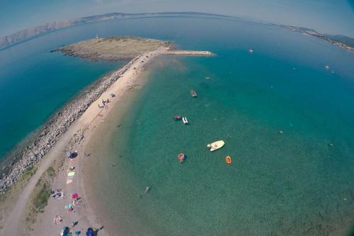 an aerial view of a beach with boats in the water at Villa Marlin in Klenovica