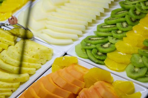 a display of different types of cheese and fruit at SDivine Fatima Hotel, Congress & Spirituality in Fátima