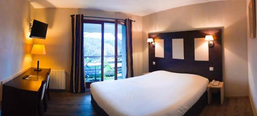 Postel nebo postele na pokoji v ubytování Hotel Alicia Auray Le Bono