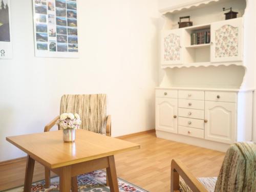 a dining room with a table and chairs at Villa Daheim Semmering in Semmering