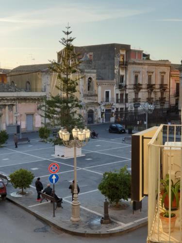 a christmas tree in the middle of a parking lot at Duomo Rooms b&b in Lentini